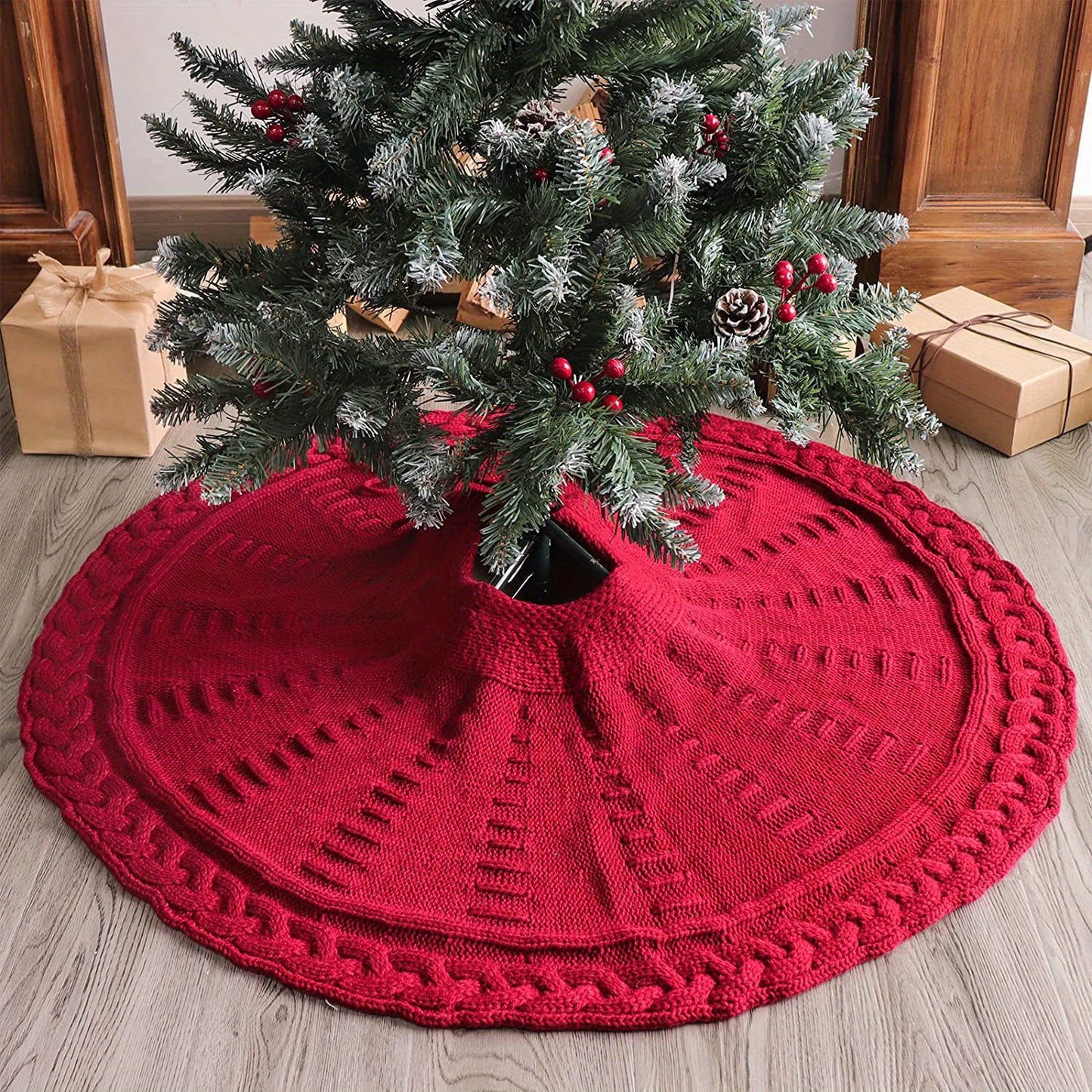 A red Rustic Knitted Christmas Tree Skirt with a tree and presents 