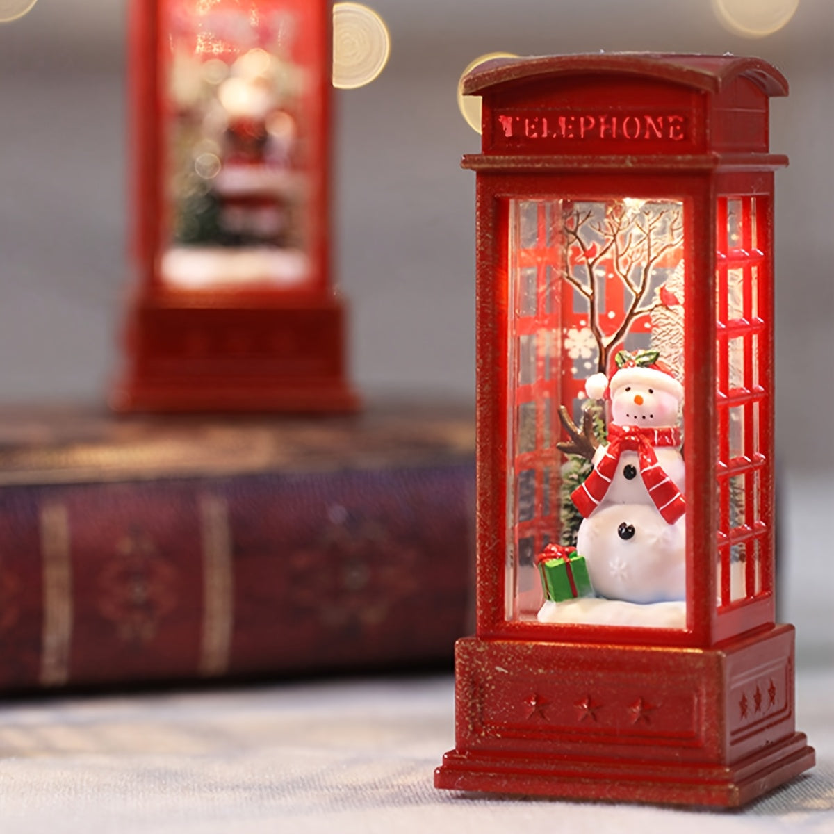 Christmas Eve Phone Booth Decor with snowman and book 