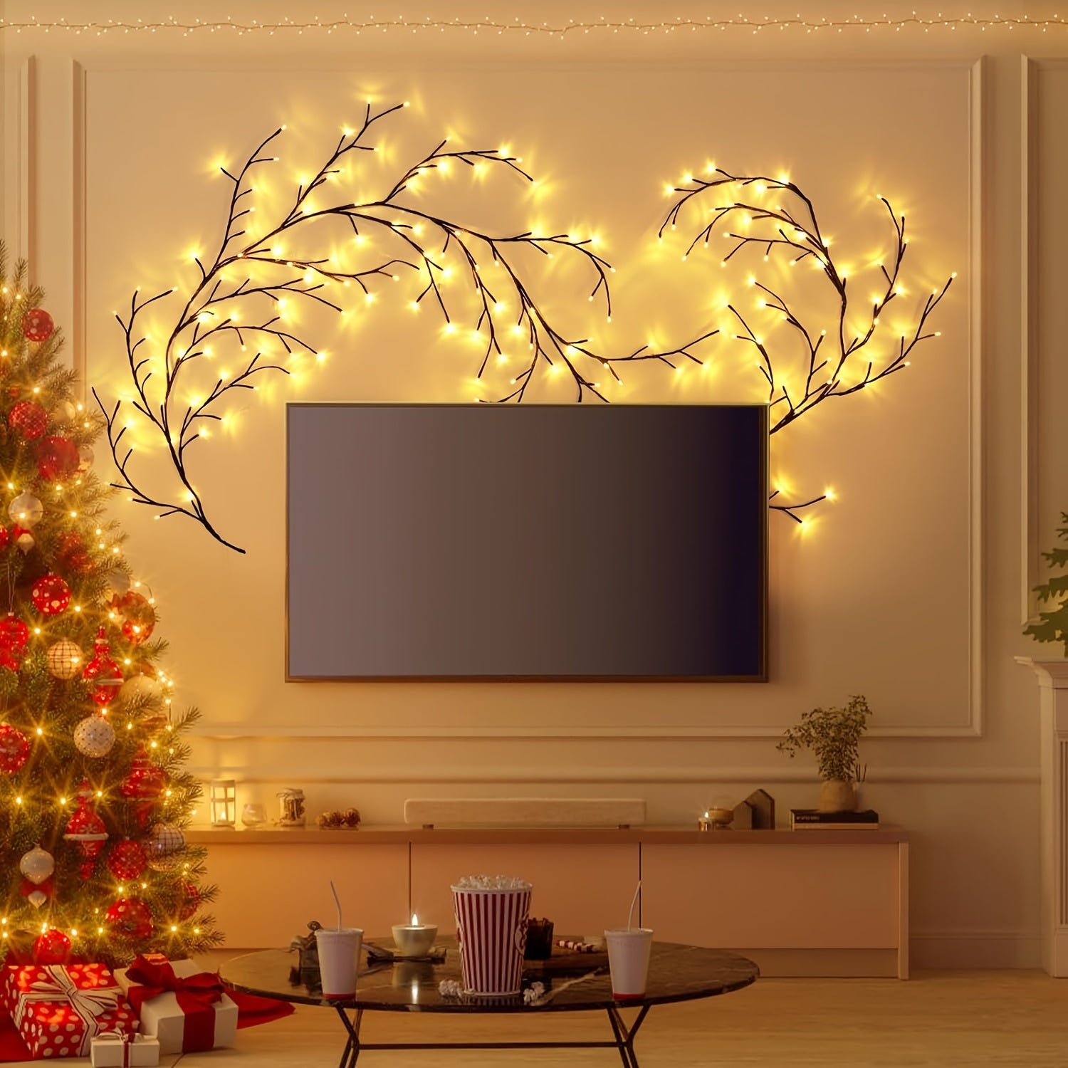 Bendable Willow Vine Lights in the wall around the TV with a tree and a table with snacks